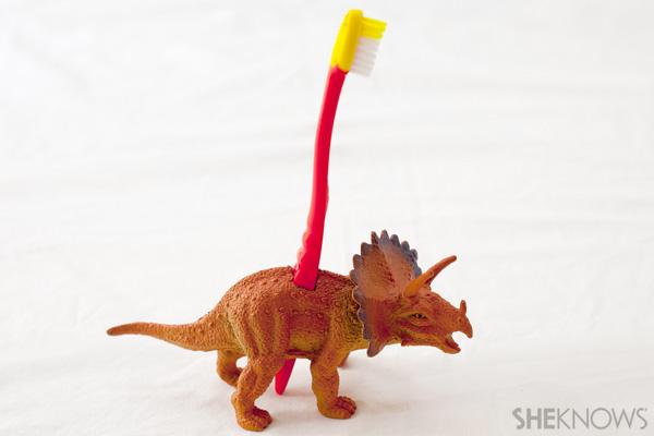 Dinoszaurusz játék fogkefe tartó
